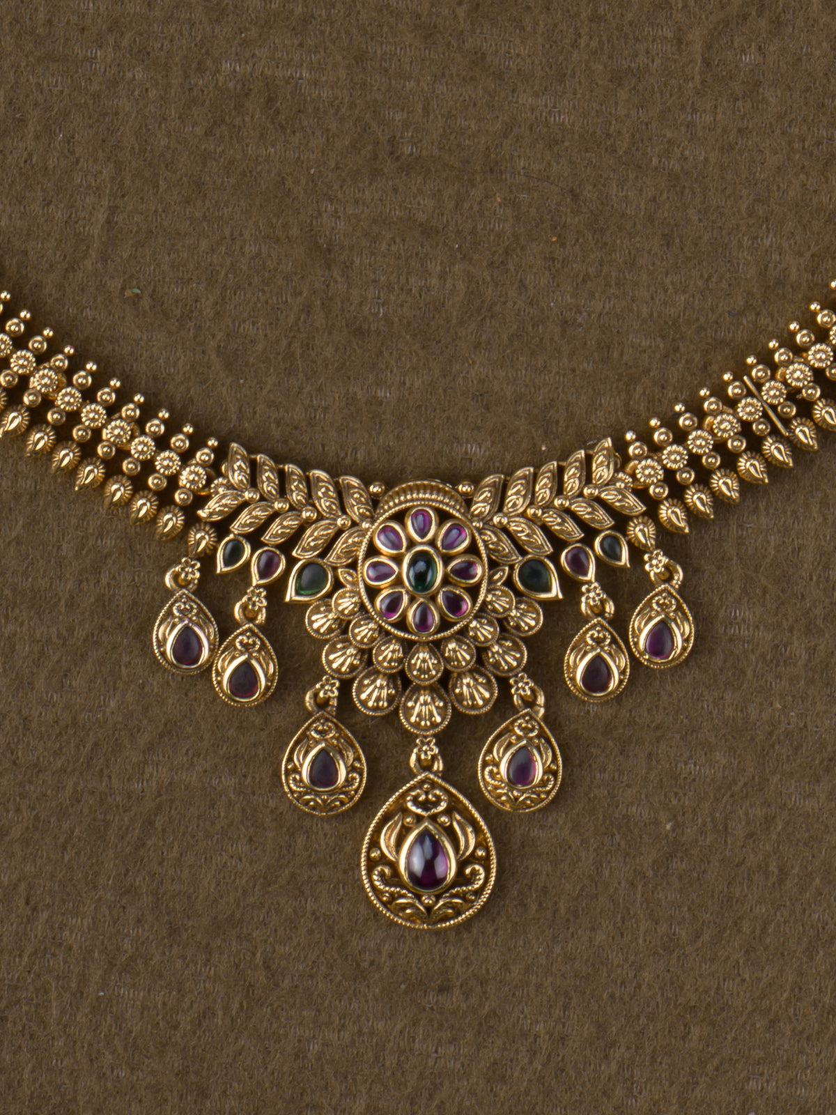 Ruby kemp floral haaram pendant close-up