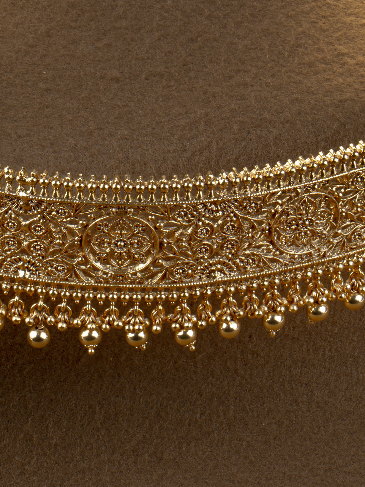 Pushpavalli Hip Belt - close-up of floral filigree panel and gold bead drops