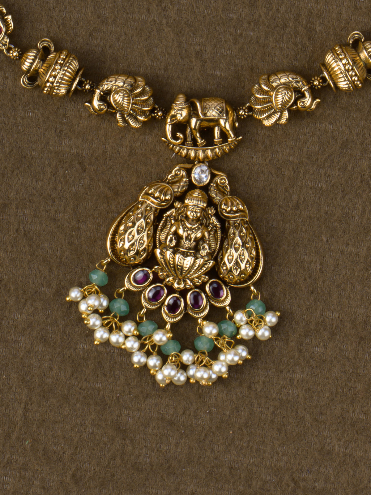 Gaja Lakshmi peacock pendant close-up