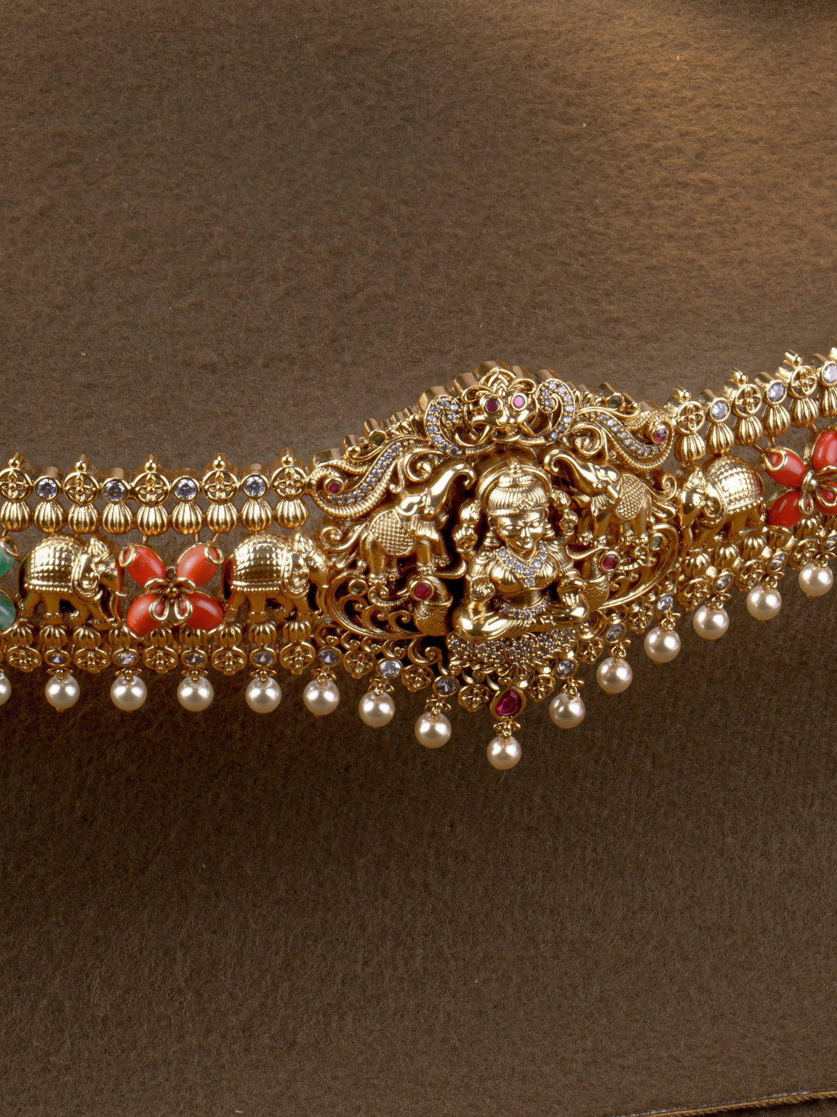 Gajalakshmi Coral Hip Belt - close-up of Gajalakshmi centrepiece with coral flower and elephant motifs