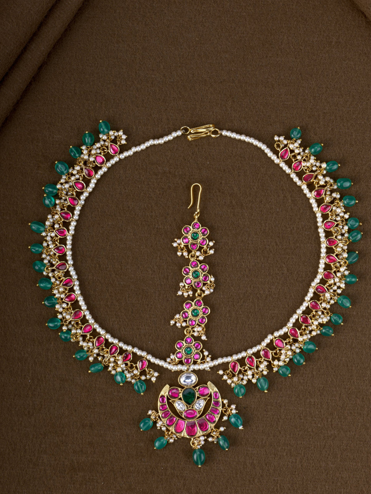 Chandrika Jadau Mathapatti - pearl and jadau bridal head ornament with ruby, green stones and crescent tikka