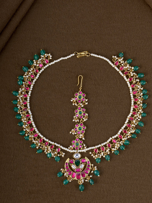 Chandrika Jadau Mathapatti - pearl and jadau bridal head ornament with ruby, green stones and crescent tikka